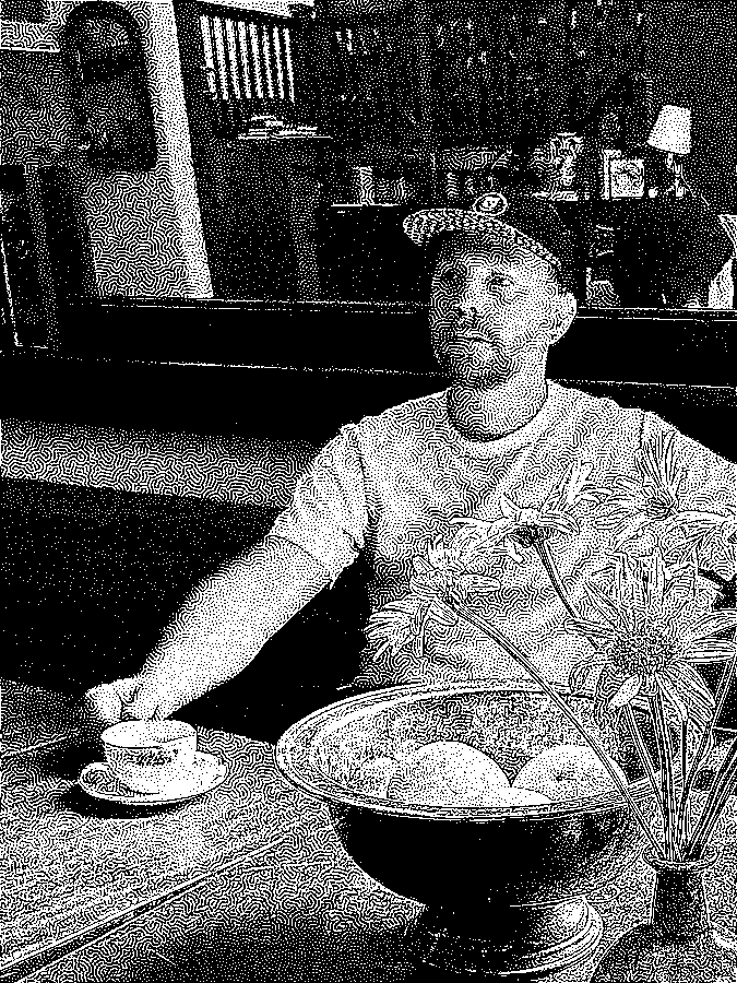 Nikolas Wise, with coffee, grapefruits, and flowers.